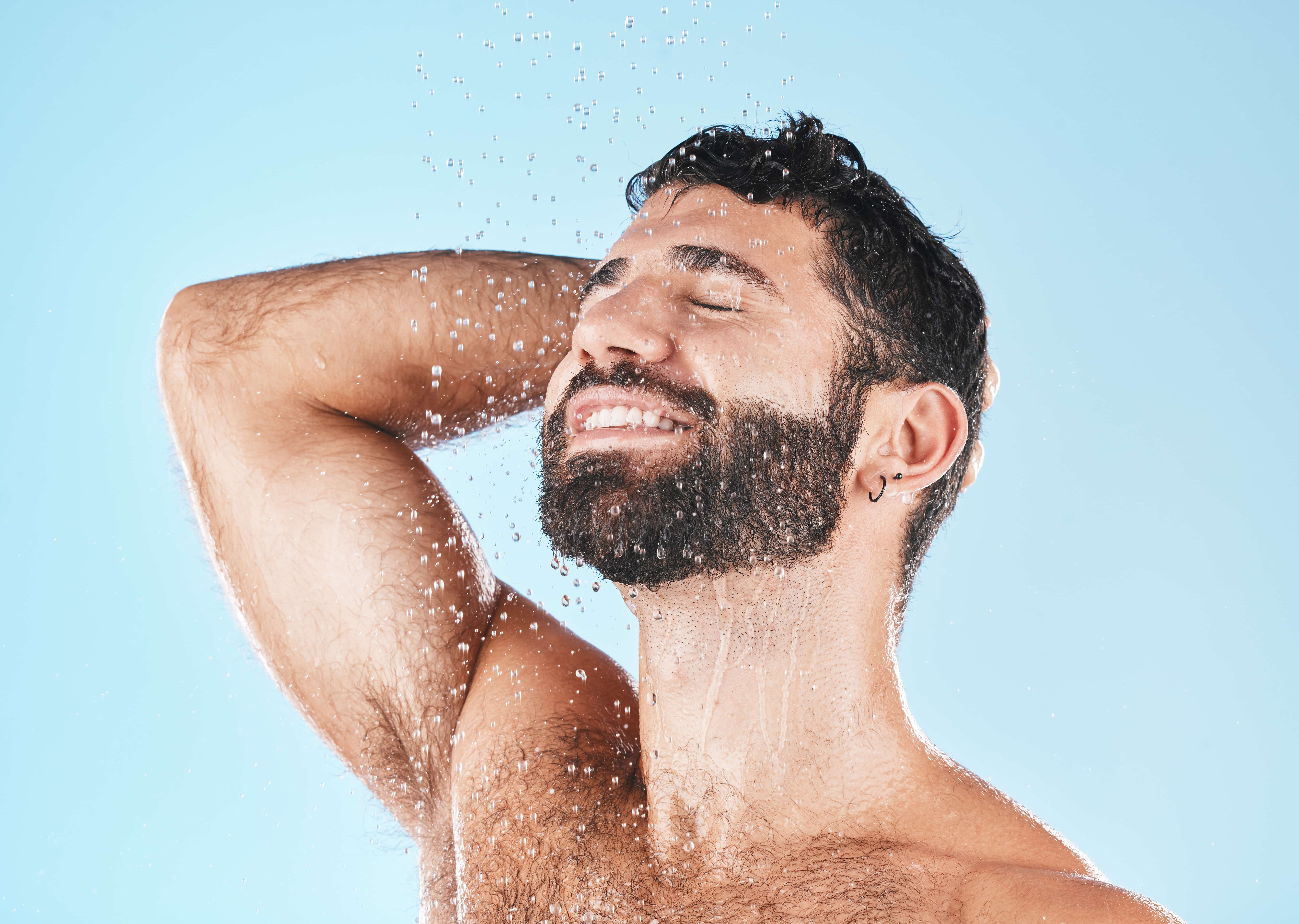 man smiling in the shower